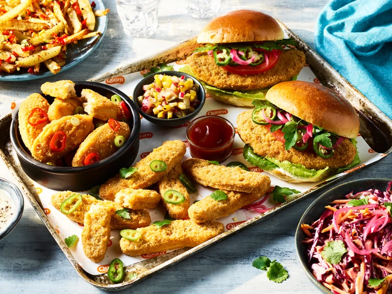 An array of Fakeaway meals including the Big Quorn Burger and Quorn Vegan Buffalo Nuggets with Blue Cheese Sauce.