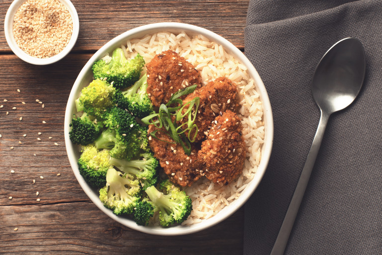 Vegan rice bowl made with Quorn Tex Mex Nuggets served on a bed of rice and topped with broccoli