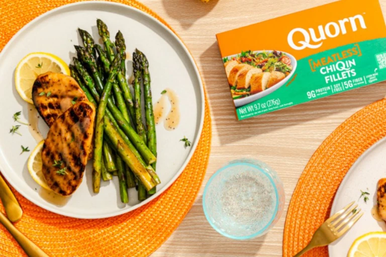 Quorn Vegetarian Fillets with asparagus and a slice of lemon next to Quorn ChiQin fillets packaging. 