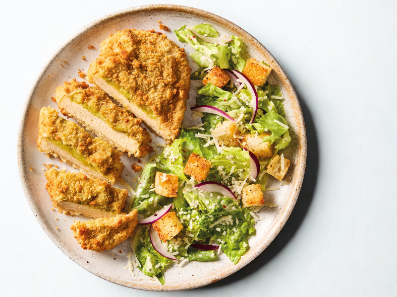 Quorn Pesto and Mozzarella Escalopes, served with caesar salad.
