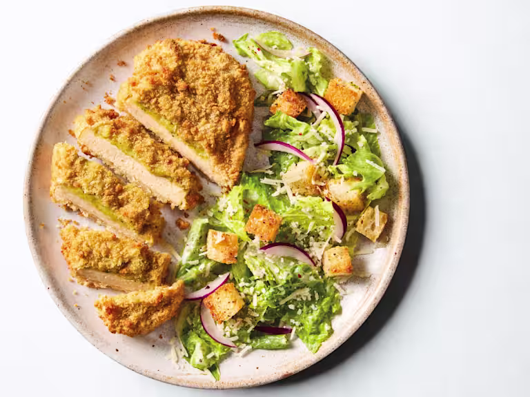 Quorn Pesto and Mozzarella Escalopes, served with caesar salad.