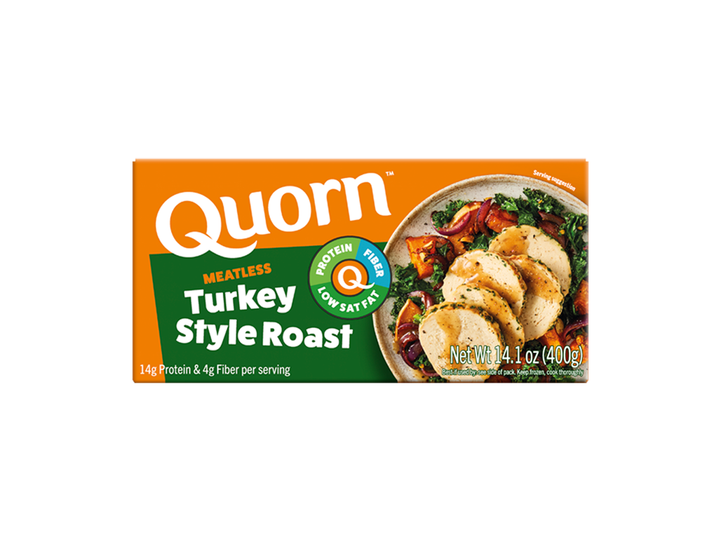 A box of Quorn Meatless Roast showing the product and the product information on an orange and charcoal background.