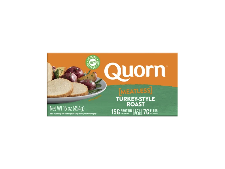 A box of Quorn Meatless Roast showing the product and the product information on an orange and charcoal background.