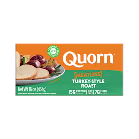A box of Quorn Meatless Roast showing the product and the product information on an orange and charcoal background.