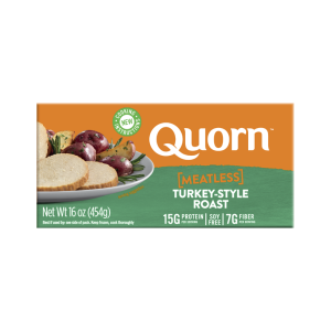 A box of Quorn Meatless Roast showing the product and the product information on an orange and charcoal background.