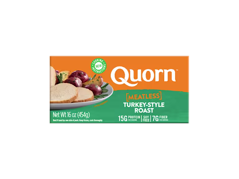 A box of Quorn Meatless Roast showing the product and the product information on an orange and charcoal background.