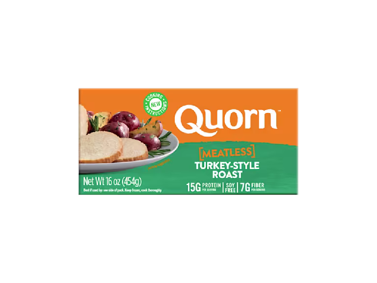 A box of Quorn Meatless Roast showing the product and the product information on an orange and charcoal background.