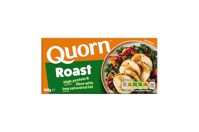 A box of Quorn Roast showing the prepared product and information on an orange and charcoal background.