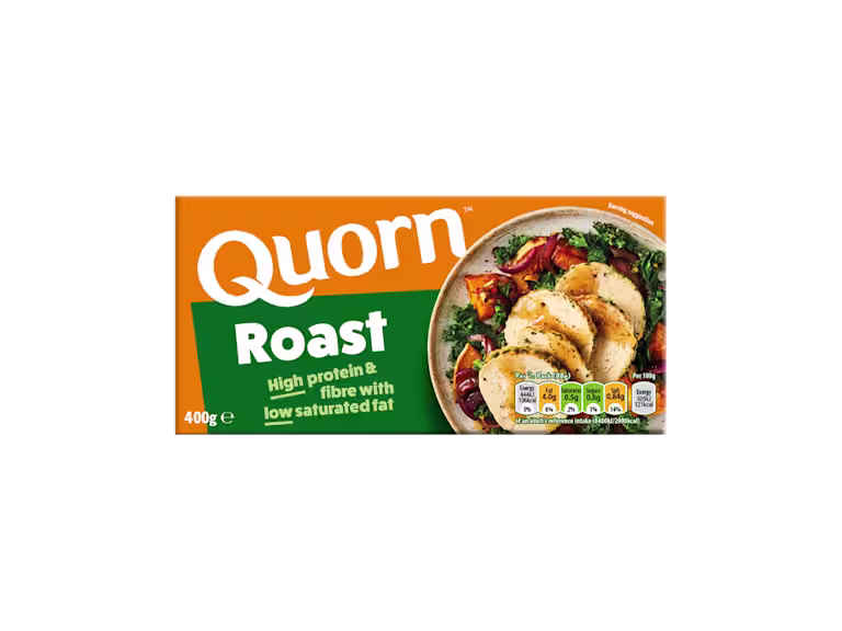A box of Quorn Roast showing the prepared product and information on an orange and charcoal background.