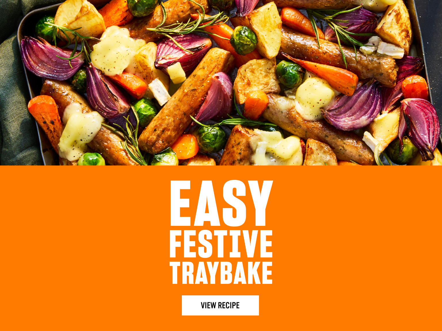 A colourful festive traybake of roasted sausages, potatoes, carrots, Brussels sprouts and red onions, topped with melted cheese and sprigs of rosemary, shown beside bright orange text reading “Easy Festive Traybake - View Recipe.