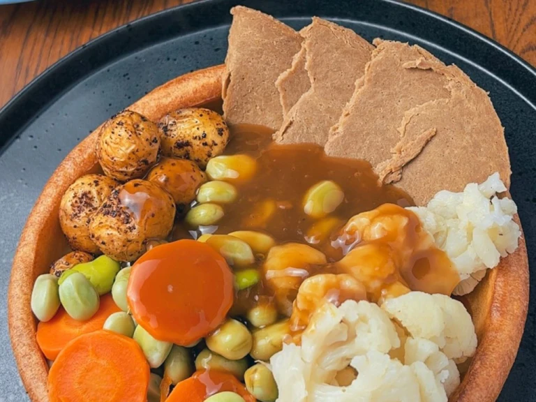 Giant Yorkshire pudding with vegetables and Quorn Roast Beef Style Slices inside