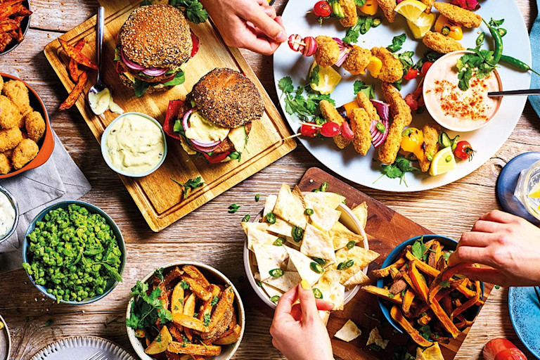An array of Fakeaway meals including the Big Quorn Burger and Quorn Vegan Buffalo Nuggets with Blue Cheese Sauce.
