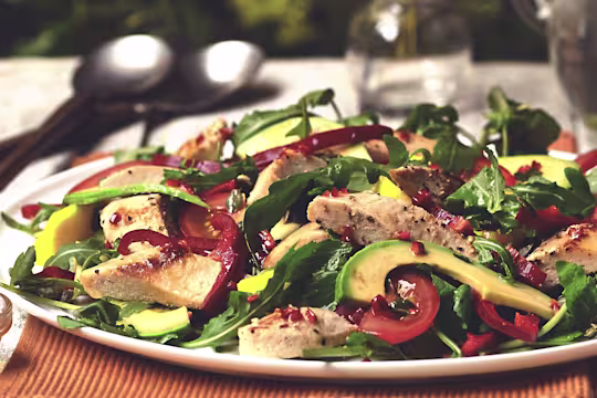 Video still of a Brazilian salad with Quorn Vegetarian fillets, sliced avocado, tomatoes and salad leaves.