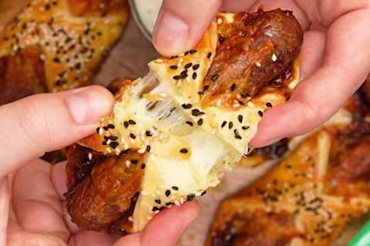 Pastry turnovers topped with sesame seeds filled with Quorn Cocktail Vegetarian Sausages, cheese and caramelised onion chutney.