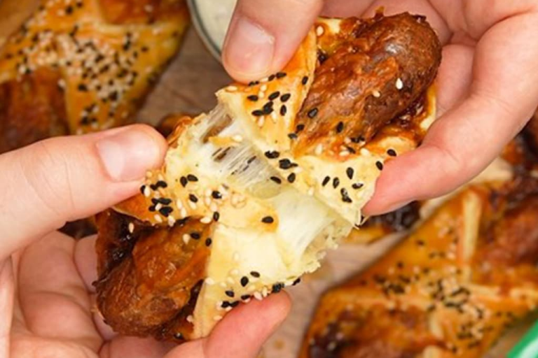 Pastry turnovers topped with sesame seeds filled with Quorn Cocktail Vegetarian Sausages, cheese and caramelised onion chutney.