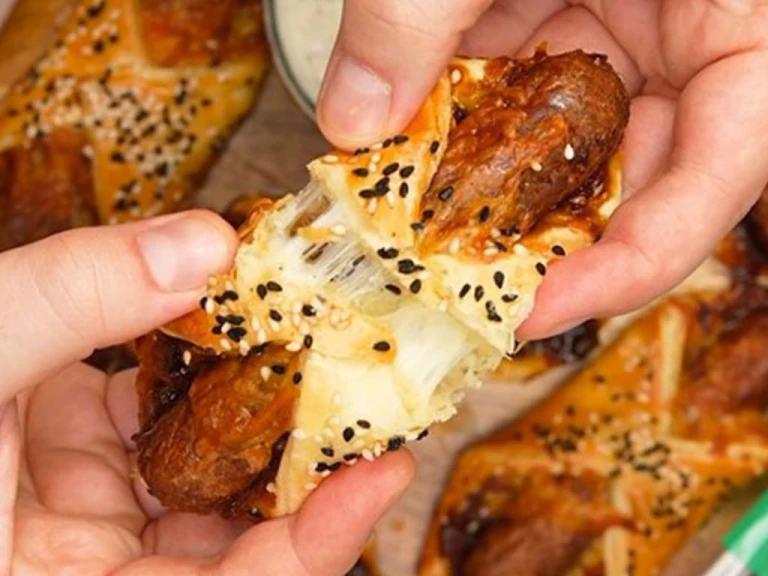 Pastry turnovers topped with sesame seeds filled with Quorn Cocktail Vegetarian Sausages, cheese and caramelised onion chutney.