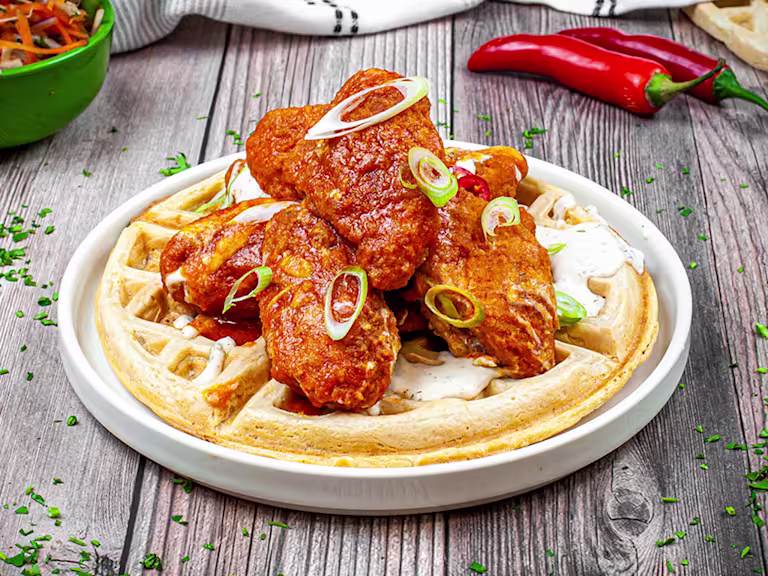 vegetarian waffles topped with vegan buffalo wings.