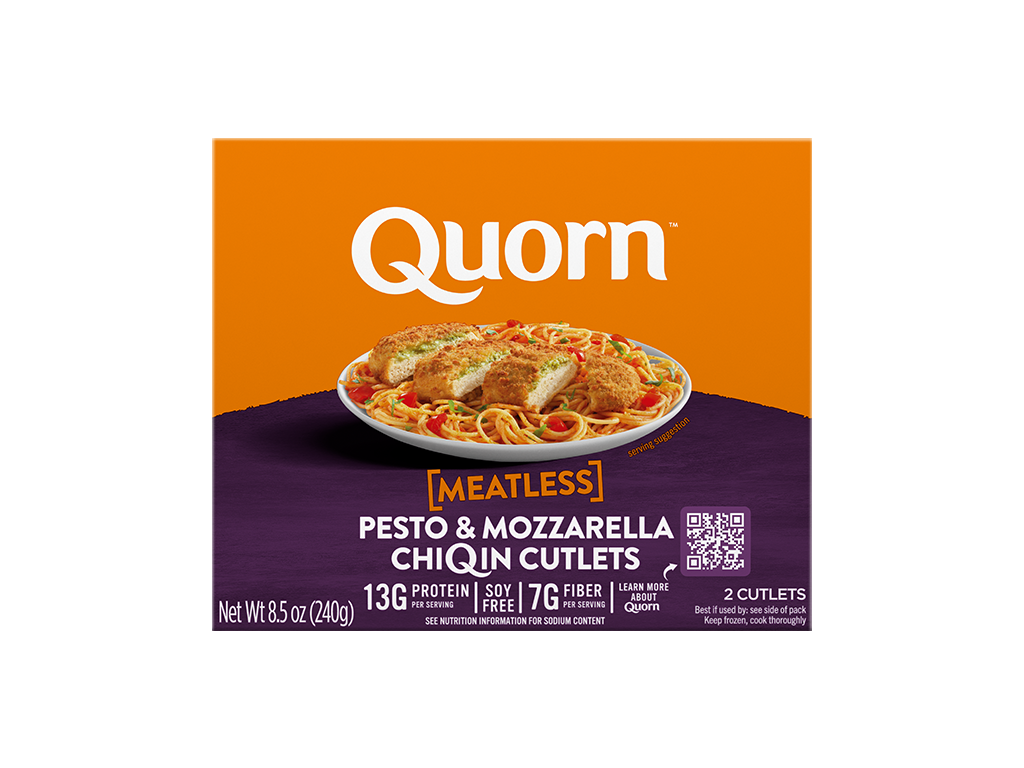A box of Quorn Meatless Pesto & Mozzarella Cutlets showing the plated product and information on a charcoal and orange background.