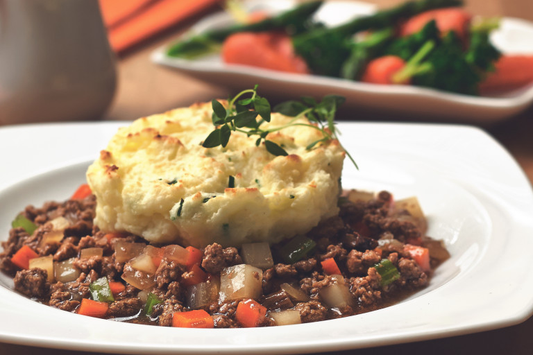 Vegetarian cottage pie deconstructed, made with Quorn Meatless Grounds served in a bowl topped with mash potato and garnish