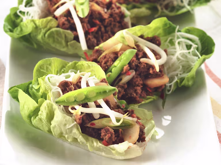 Vegetarian lettuce cups filled with Quorn Mince and vermicelli noodles, topped with beansprouts and sliced snow peas