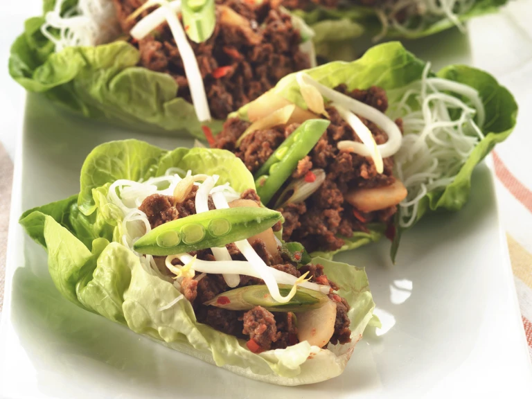 Vegetarian lettuce cups filled with Quorn Mince and vermicelli noodles, topped with beansprouts and sliced snow peas