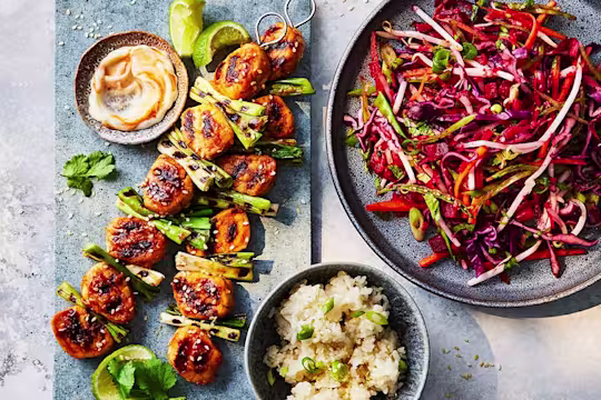 Three sticky gochujang skewers made with Quorn fillet pieces with an Asian slaw on the side.