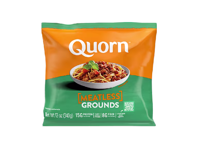 A bag and a box of Quorn Meatless Grounds showing the plated product and information on an orange and charcoal background.