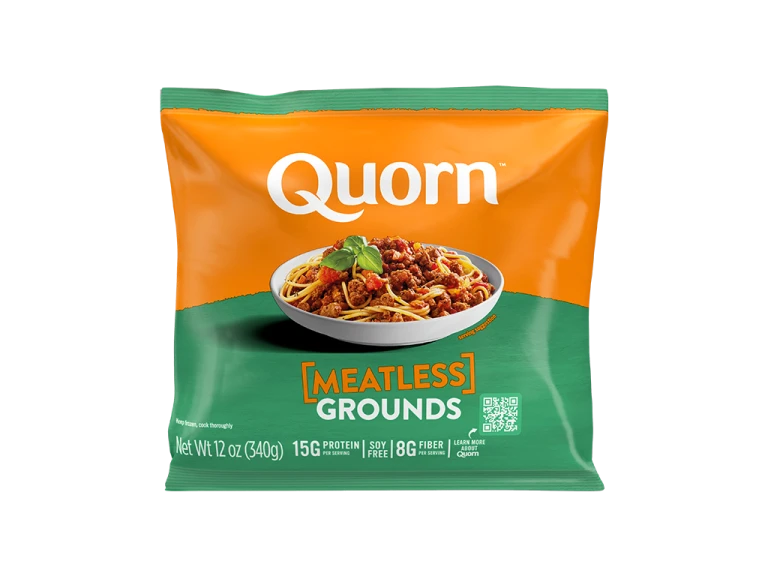 A bag and a box of Quorn Meatless Grounds showing the plated product and information on an orange and charcoal background.
