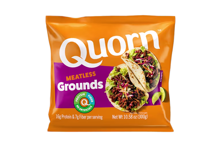 A bag and a box of Quorn Meatless Grounds showing the plated product and information on an orange and charcoal background.