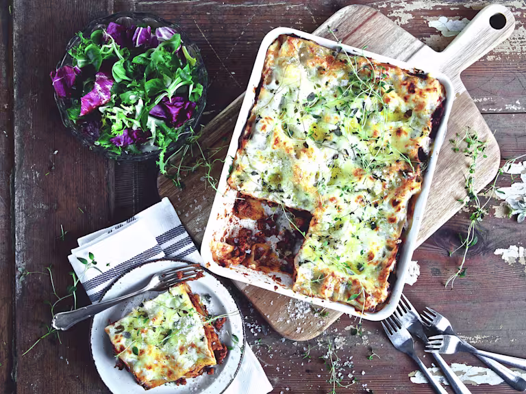 Quick and easy meal of lasagne made with Quorn Mince served in a saucepan and a side serving in a small bowl