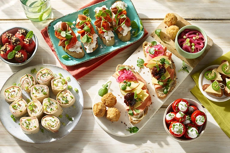 Vegetarian lunch recipe made with Quorn Sausage and pasta served in colourful Tupperware containers and cutlery