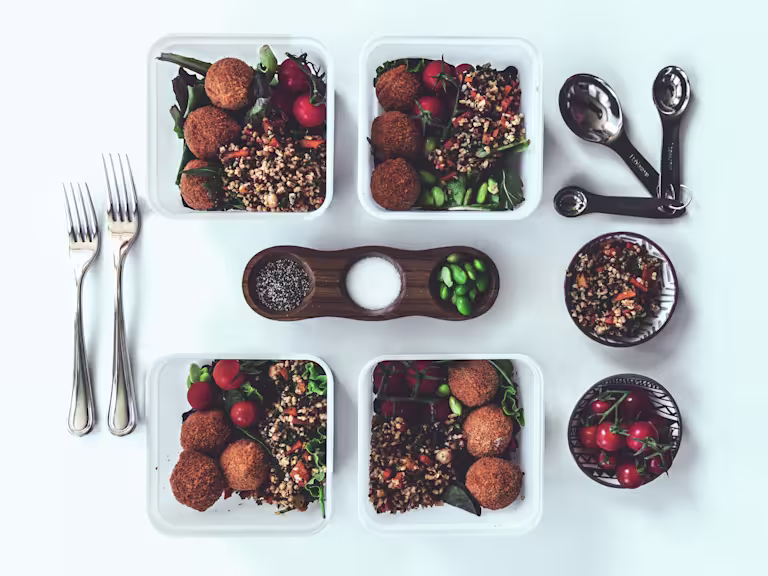 Healthy salad recipe made with Quorn Mini Savoury Eggs, pilaf rice and quinoa served in individual Tupperware boxes