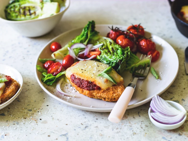 Vegan parmigiana with charred lettuce salad