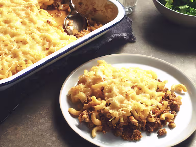 A porition of Quorn Vegetarian Mac And Cheese made using Quorn Meatless Grounds with a full dish on the side.