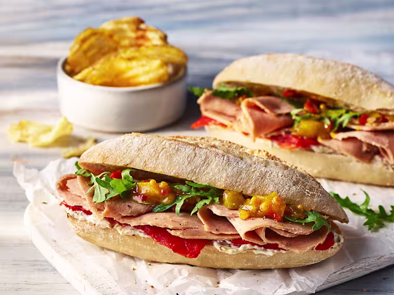 A roasted Jacket Potato topped with Chili con Carne with Quorn mince and sat beside a healthy salad.