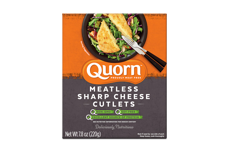 A box of Quorn Meatless Sharp Cheese Cutlets showing the product and product information on an orange and charcoal background.
