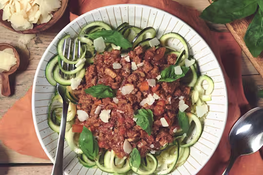 Quorn Courgetti Bolognese, made with Quorn Mince, carrots, mushrooms, celery and onion, served on a plate