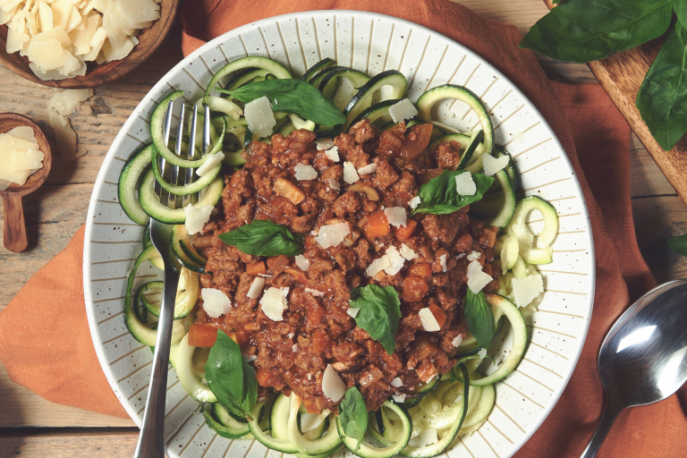 Quorn Courgetti Bolognese, made with Quorn Mince, carrots, mushrooms, celery and onion, served on a plate