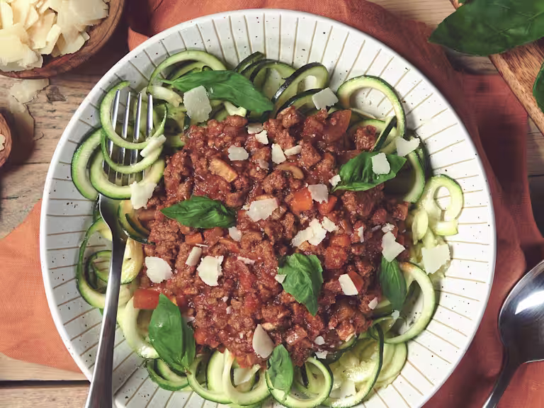 Quorn Courgetti Bolognese, made with Quorn Mince, carrots, mushrooms, celery and onion, served on a plate