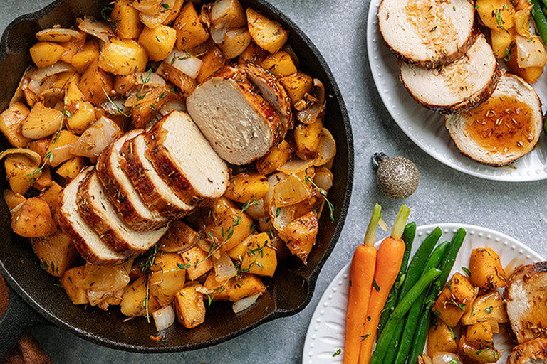 One-pot maple glazed Christmas roast served in a dish with Quorn Roast and roasted vegetables on the side.