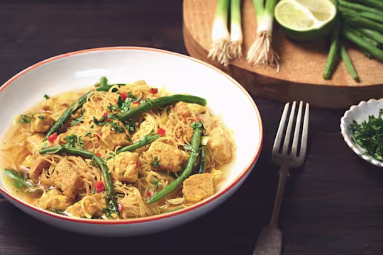 A bowl of Laksa made with Quorn pieces, chilli and ginger, and served with rice noodles.