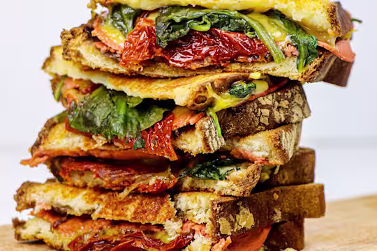 The vegan ploughman's toastie stacked high.