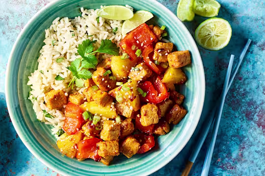 Vegetarian Hawaiian BBQ Poke Bowl served along with rice ina blue dish with blue chopsticks on the side.