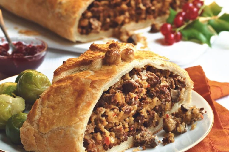 Quorn Meatless wellington slices to see the filling served alongside Brussel sprouts.