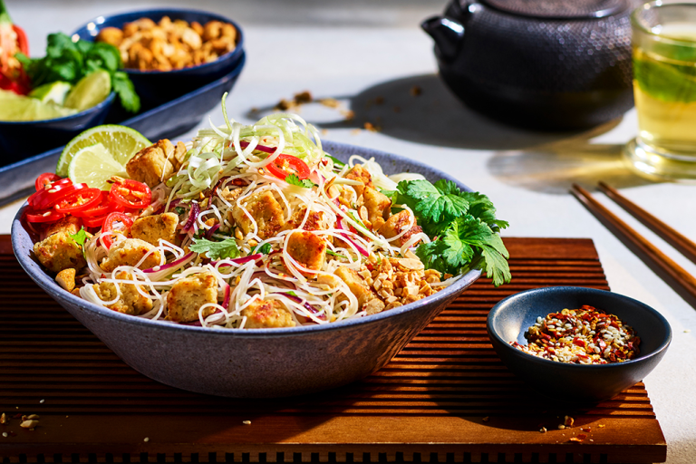 Veggie Pad Thai recipe made with Quorn Pieces and noodles served in a bowl, garnished with chilli and coriander