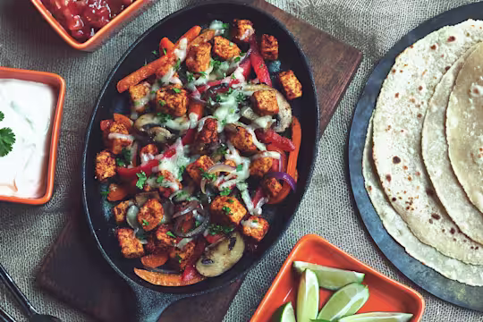 Quorn fajitas served in a black dish