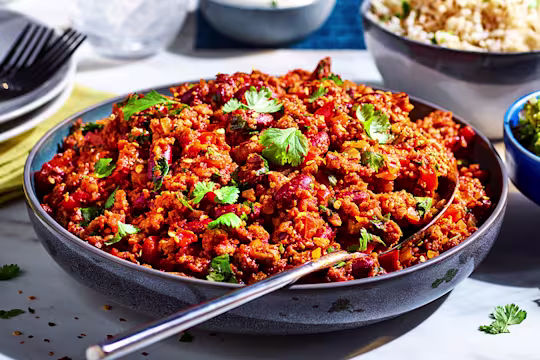Vegetarian Chilli con Carne made with meat free Quorn Mince, served in a sauce pan with tortilla chips on the side