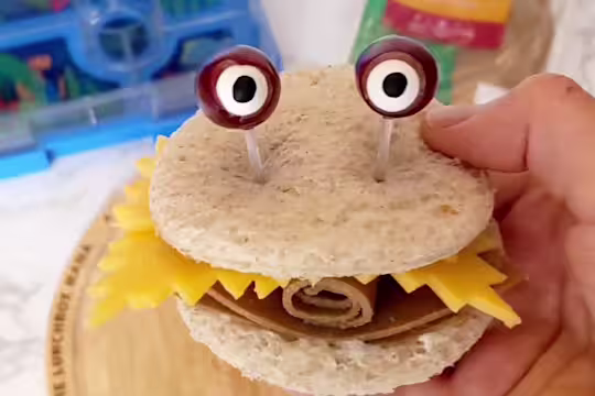 Cheese and Quorn Roast Beef Style Slices sandwich with eyes poking out the top