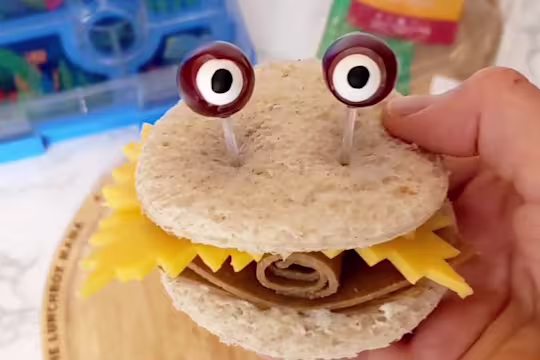 Cheese and Quorn Roast Beef Style Slices sandwich with eyes poking out the top