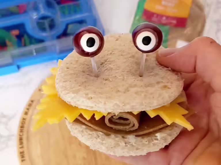 Cheese and Quorn Roast Beef Style Slices sandwich with eyes poking out the top